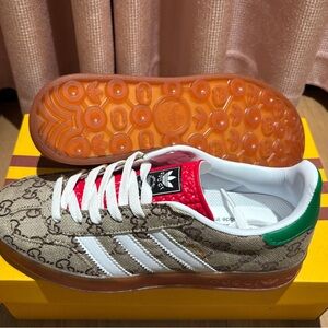 Gucci Athletic Shoes with Red, Green, and Brown Accents